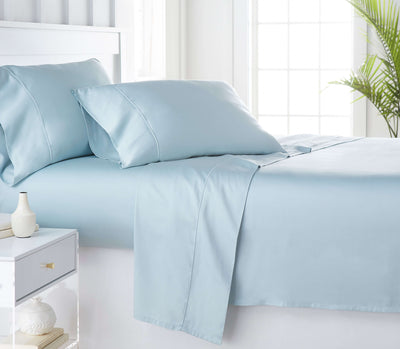 Blue organic bamboo bed sheets on the bed